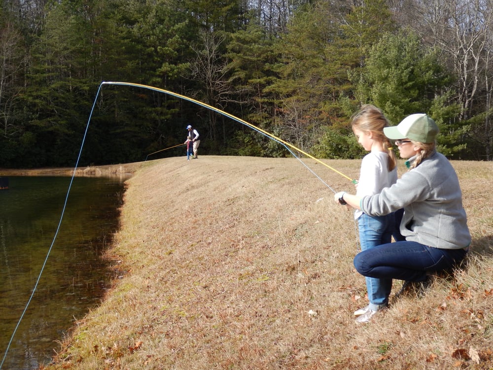 Corey and Philip teaching kids to fish