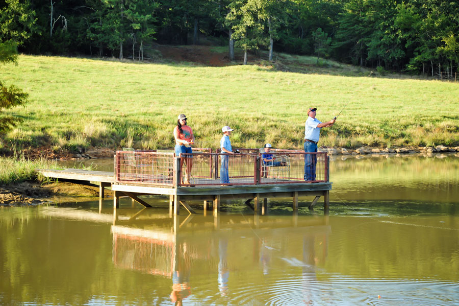 Outz family fishing in their stocked pond