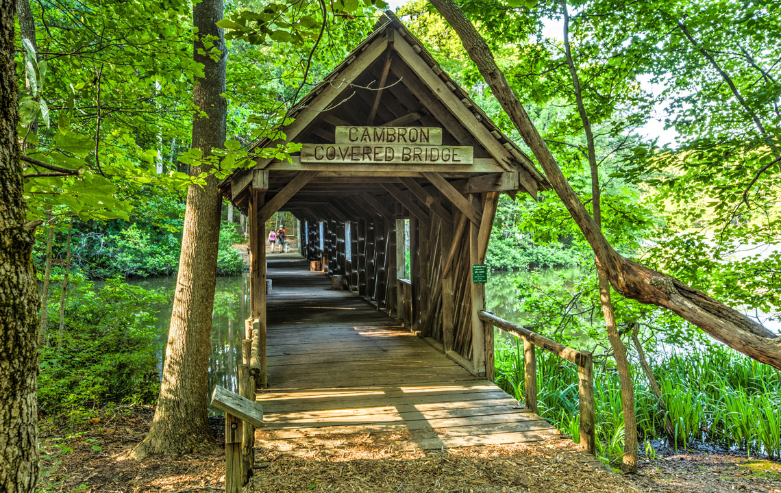 Take a beautiful photo tour of the Cambron Covered Bridge in Huntsville, Alabama, and learn the history behind it.