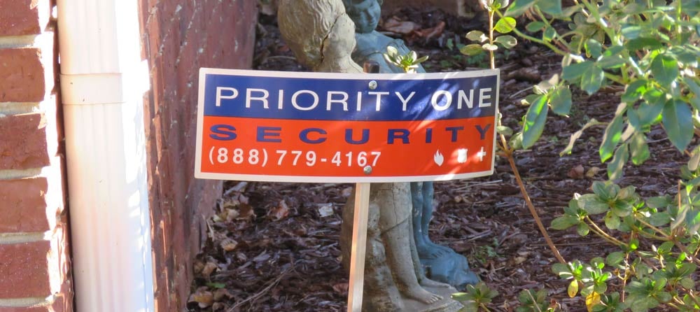 Priority One security sign in ground